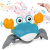 Jouet crabe interactif bleu avec musique et mouvements pour stimuler les sens du bébé