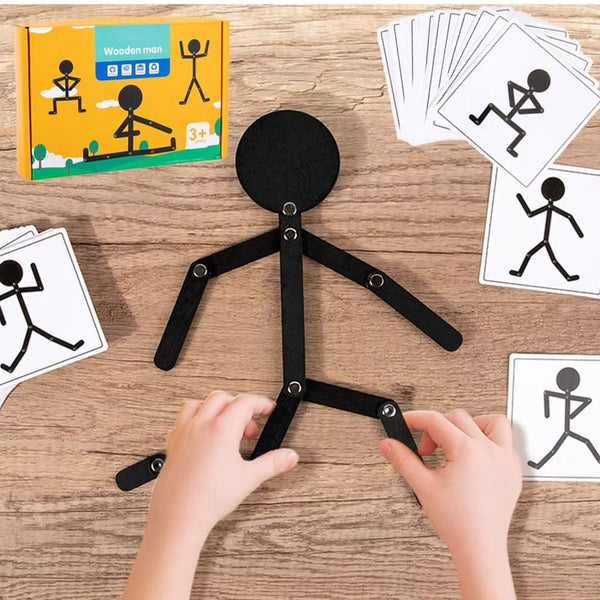 mains d’enfant manipulant un puzzle articulé en bois Montessori sur table